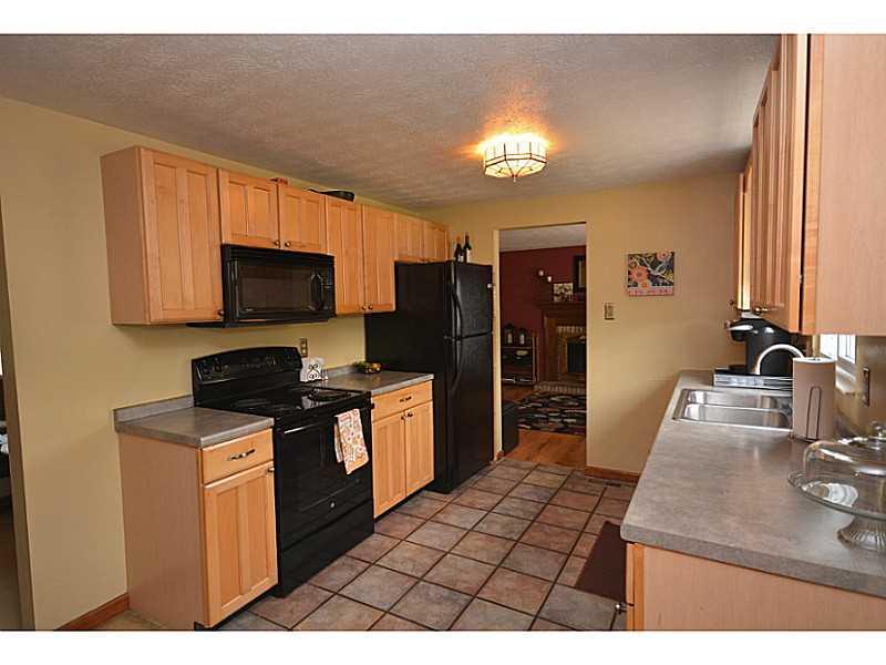 109 Phillips Lane McKees Rocks, PA 15136 - Photo 8 of 25 Kitchen. Kitchen is outfitted with black appliances.