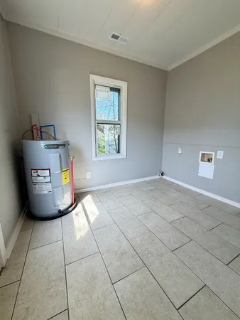a view of a storage & utility room with a window