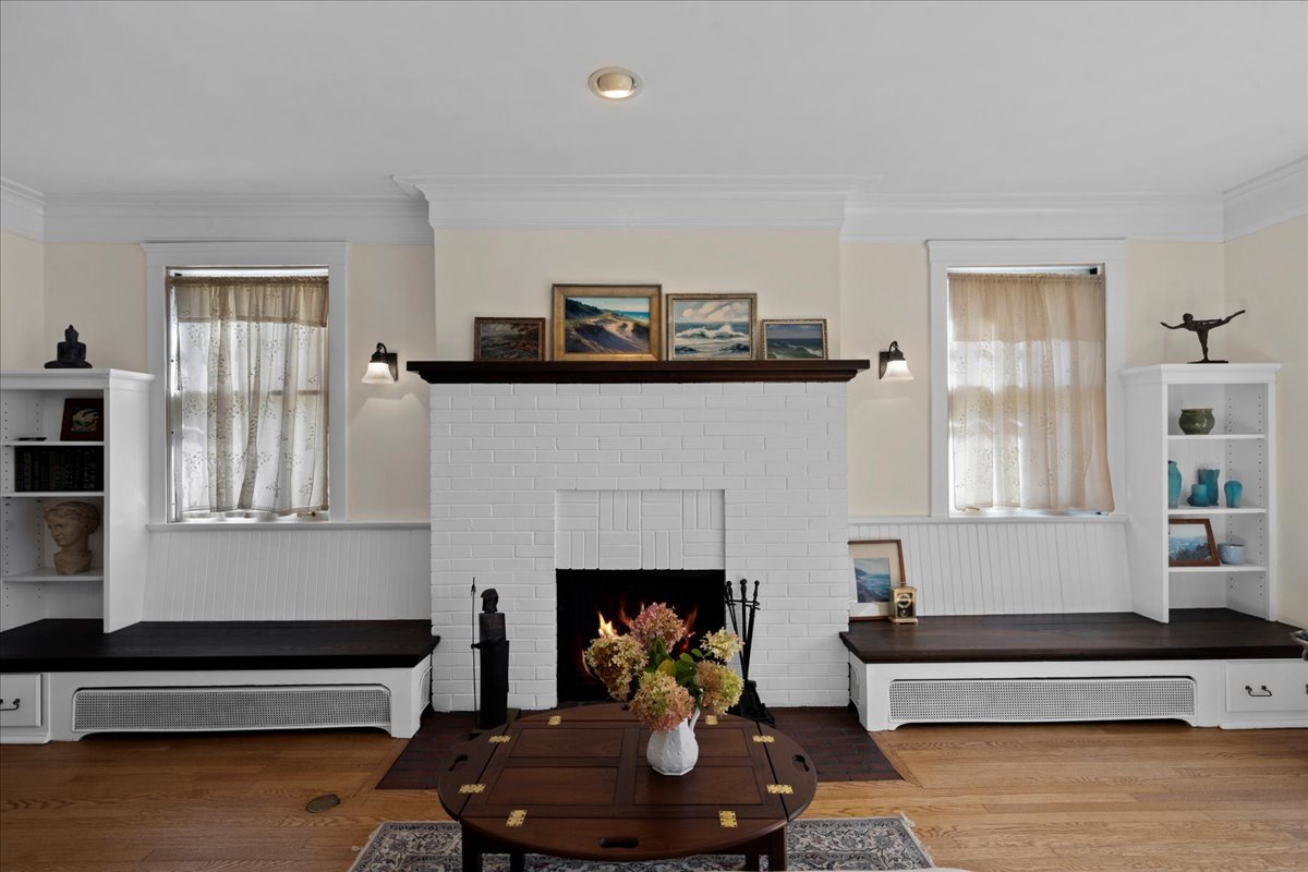 611 Ash Street Winnetka, IL 60093 - Photo 20 of 43 a living room with furniture and a fireplace