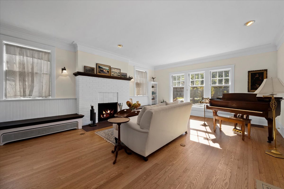 611 Ash Street Winnetka, IL 60093 - Photo 21 of 43 a living room with furniture and a fireplace