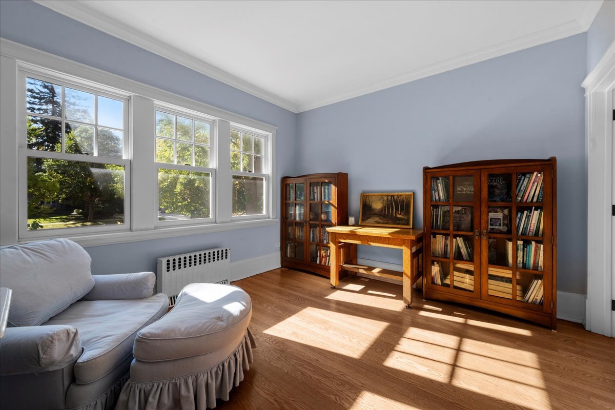 611 Ash Street Winnetka, IL 60093 - Photo 22 of 43 a living room with furniture a window and a flat screen tv