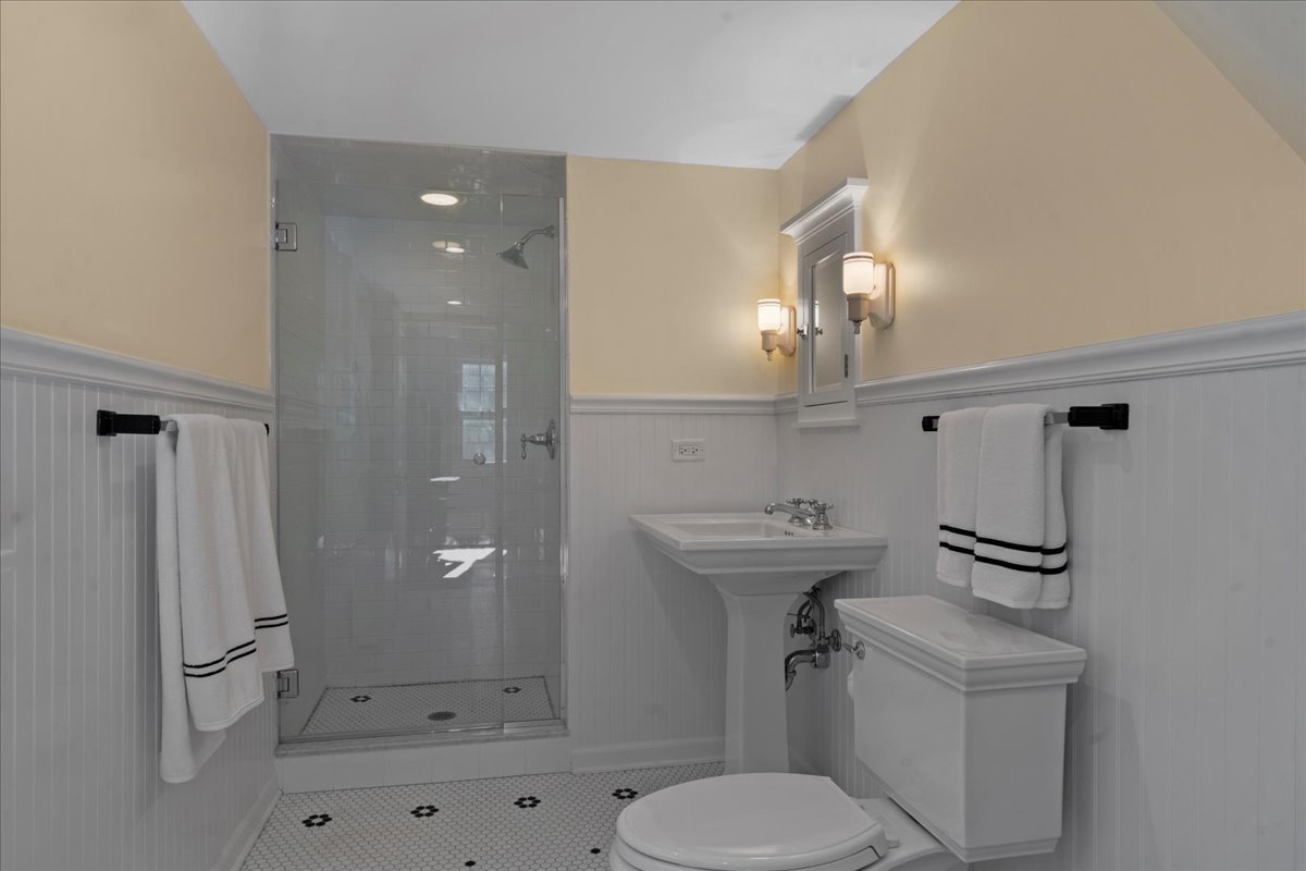 611 Ash Street Winnetka, IL 60093 - Photo 23 of 43 a bathroom with a sink toilet and shower