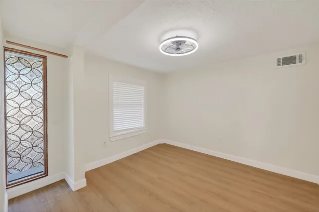 an empty room with windows