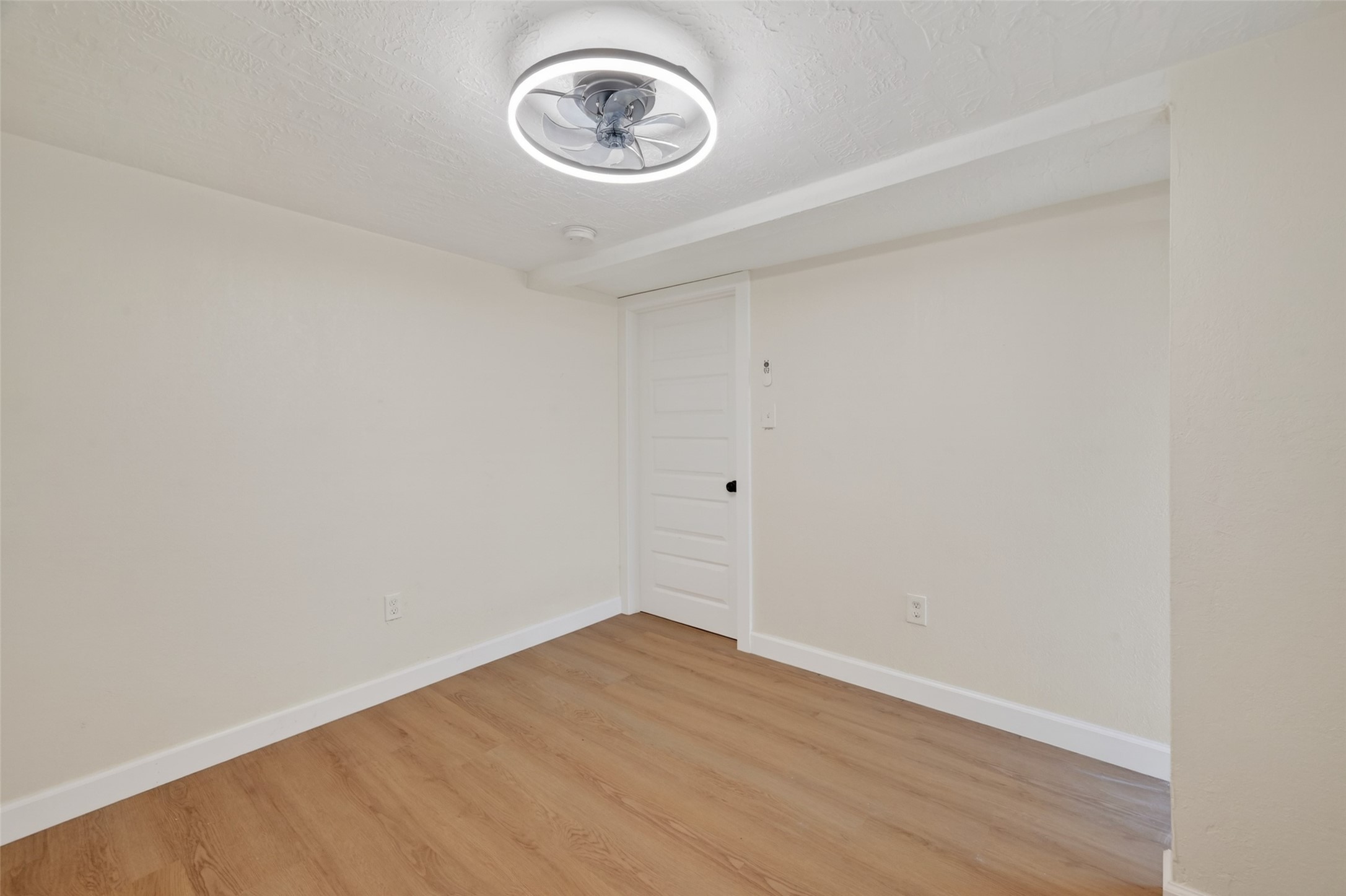 2118 Webster Street, Unit 3 Houston, TX 77003 - Photo 15 of 24 a view of a room with wooden floor and a window
