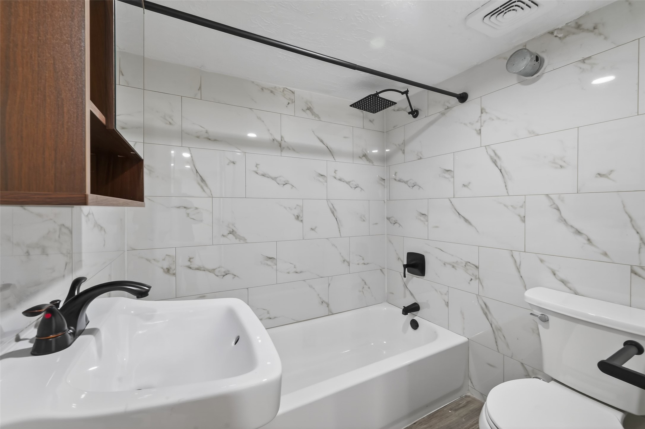 2118 Webster Street, Unit 3 Houston, TX 77003 - Photo 18 of 24 a bathroom with a sink a toilet and shower