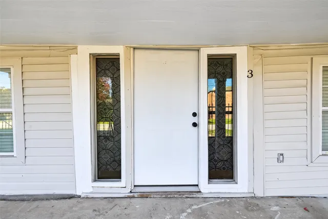 front view of a house with a door and a window