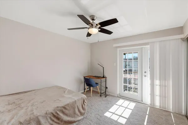 a view of a livingroom with a walk in closet and bedroom