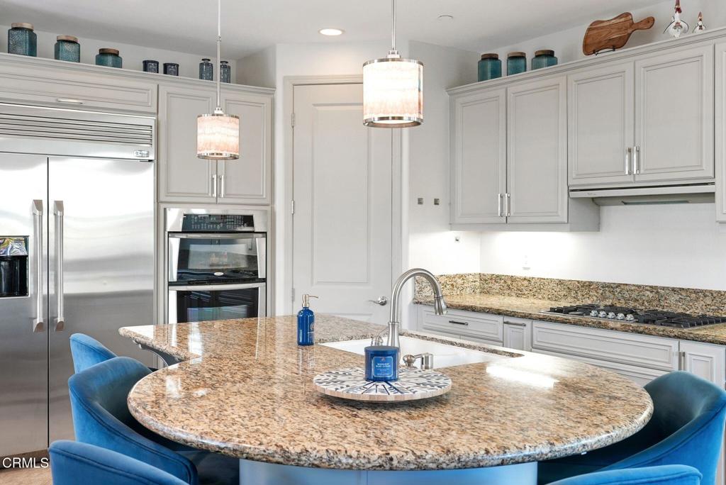 1424 Donegal Way Oxnard, CA 93035 - Photo 11 of 64 a kitchen with cabinets and refrigerator