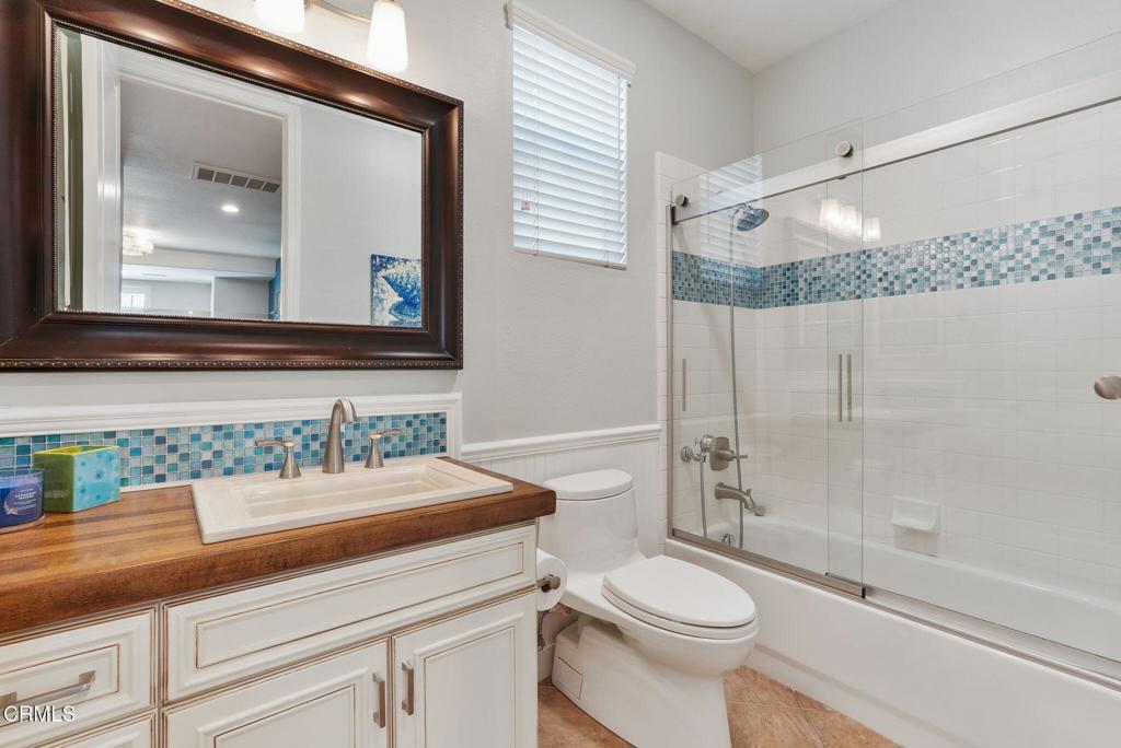 1424 Donegal Way Oxnard, CA 93035 - Photo 23 of 64 a bathroom with a sink toilet and shower