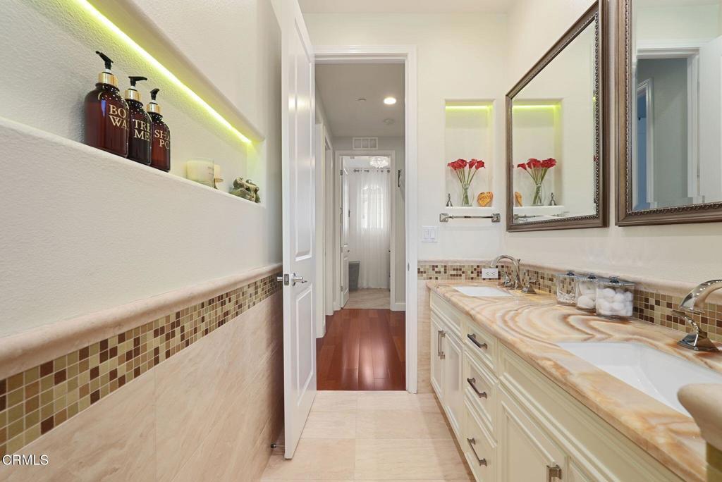 1424 Donegal Way Oxnard, CA 93035 - Photo 32 of 64 a bathroom with a double vanity sink mirror and double