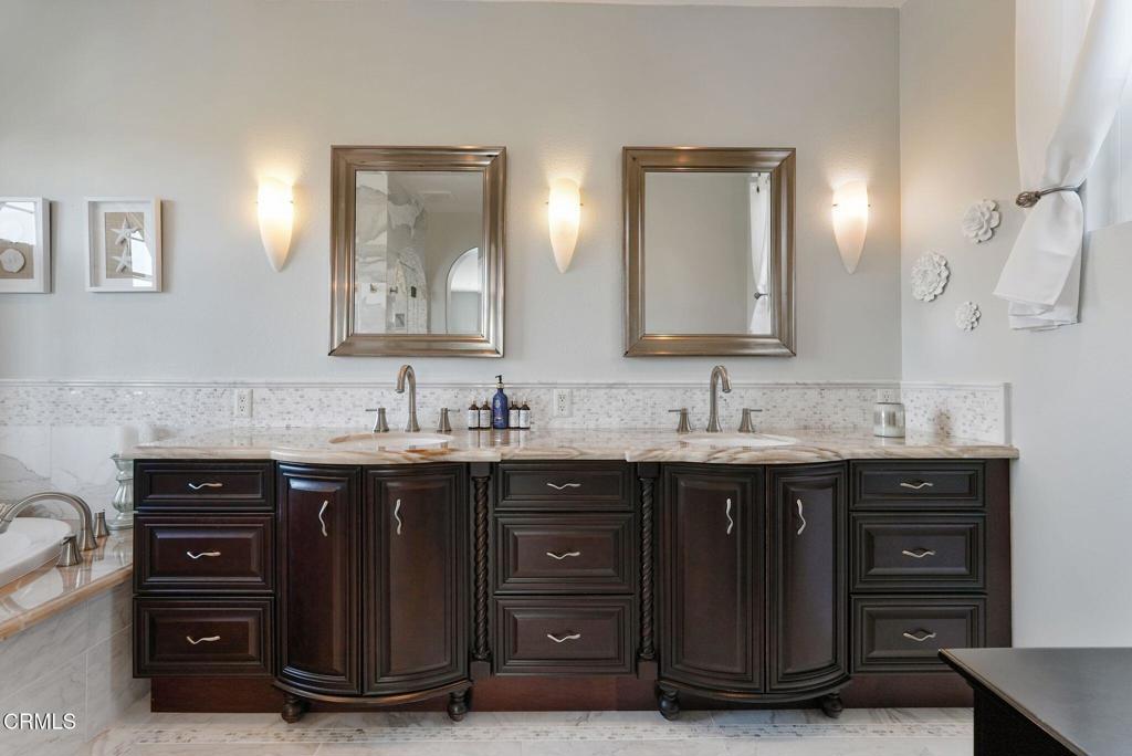1424 Donegal Way Oxnard, CA 93035 - Photo 43 of 64 a bathroom with a double vanity sink and mirror