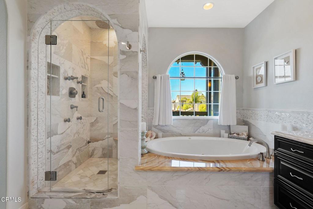 1424 Donegal Way Oxnard, CA 93035 - Photo 44 of 64 a bathroom with a sink and a shower
