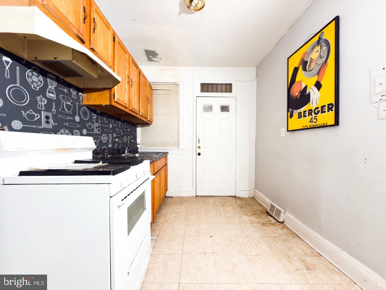711 Florida Avenue Northeast Washington, DC 20002 - Photo 14 of 46 a kitchen with stainless steel appliances granite countertop a stove a sink and a microwave