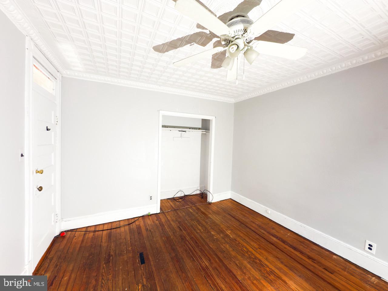711 Florida Avenue Northeast Washington, DC 20002 - Photo 21 of 46 a view of a room with wooden floor and a ceiling fan