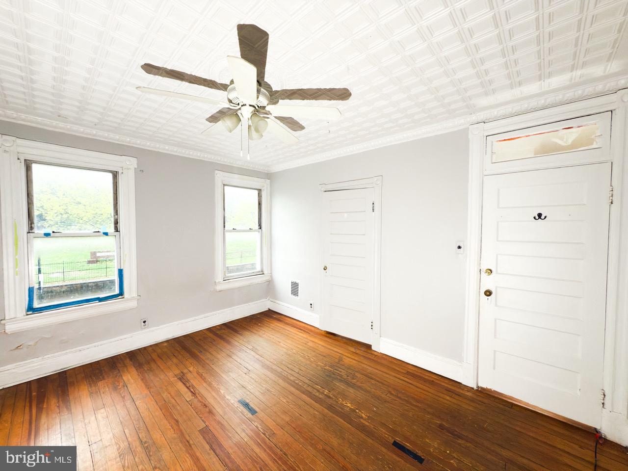 711 Florida Avenue Northeast Washington, DC 20002 - Photo 22 of 46 a view of an empty room with wooden floor and a window