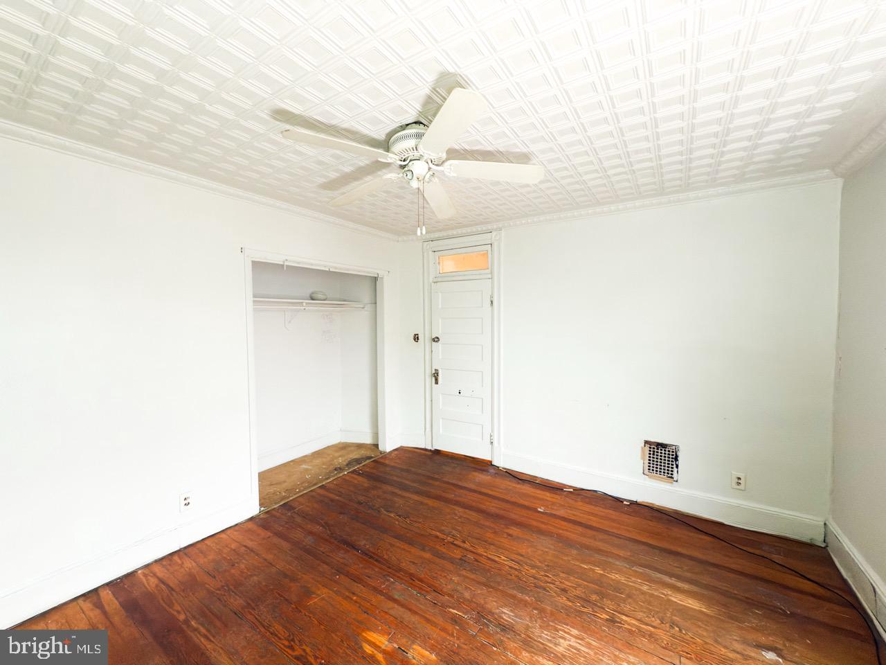 711 Florida Avenue Northeast Washington, DC 20002 - Photo 24 of 46 a bedroom with a bed and a ceiling fan