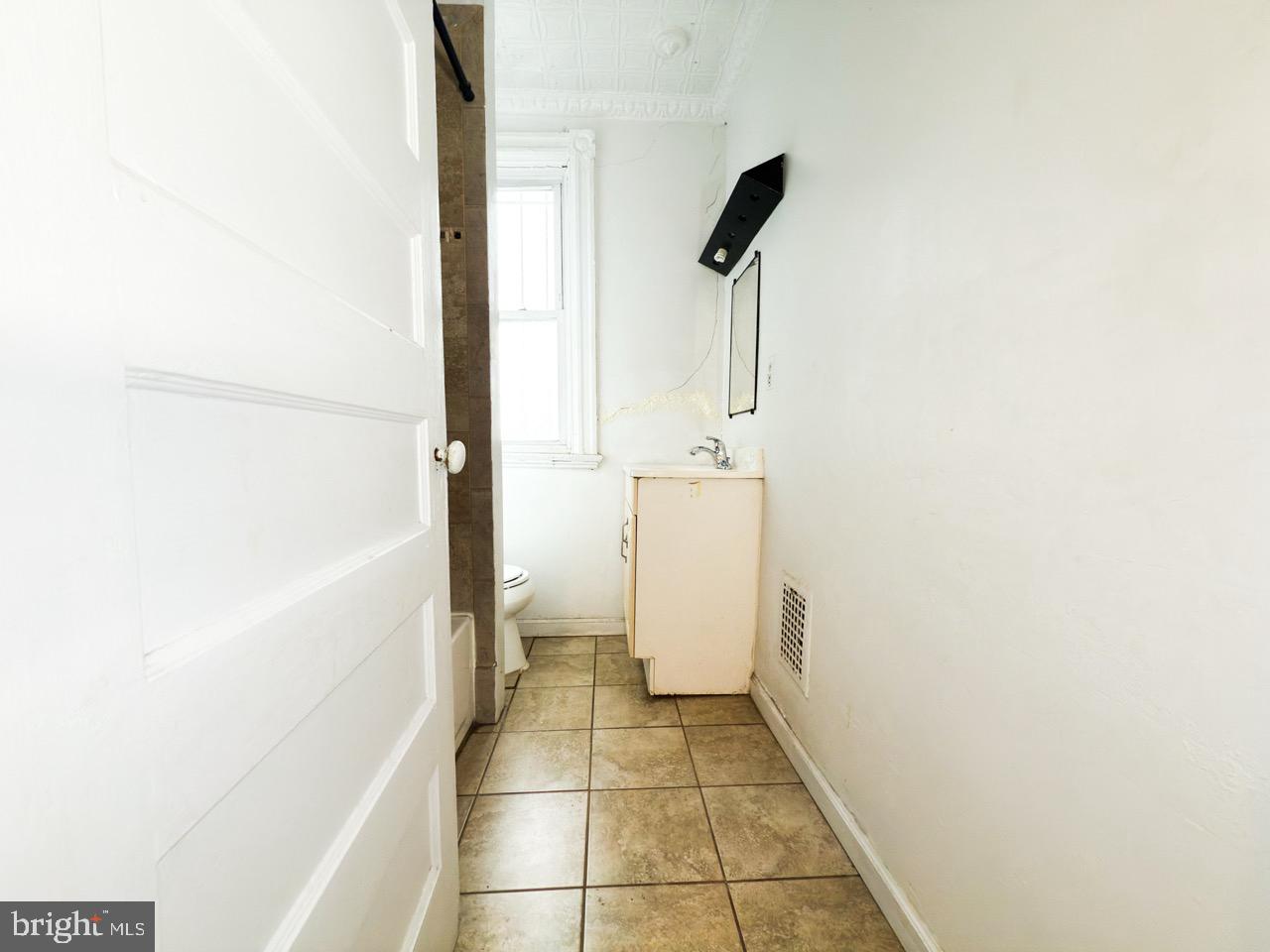 711 Florida Avenue Northeast Washington, DC 20002 - Photo 26 of 46 a bathroom with a sink and a shower