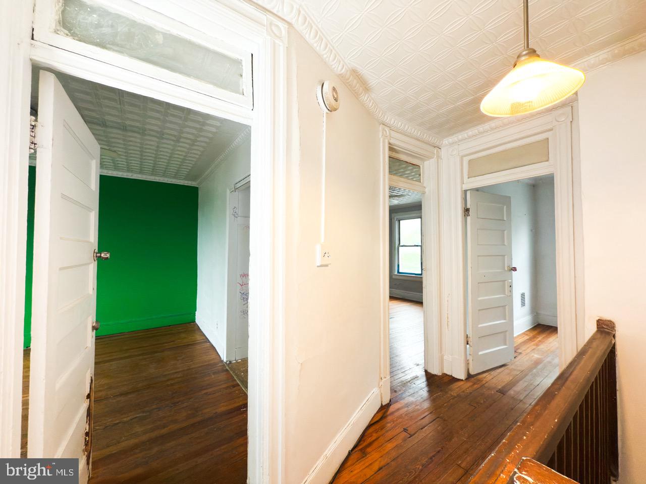 711 Florida Avenue Northeast Washington, DC 20002 - Photo 29 of 46 a view of a hallway with wooden floor and staircase