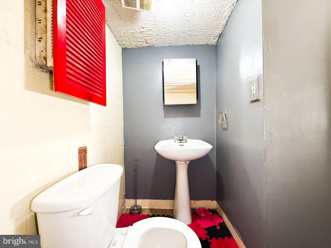 711 Florida Avenue Northeast Washington, DC 20002 - Photo 33 of 46 a bathroom with a sink toilet and shower