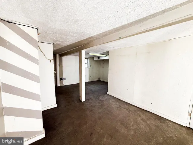 a view of room with wooden floor and window