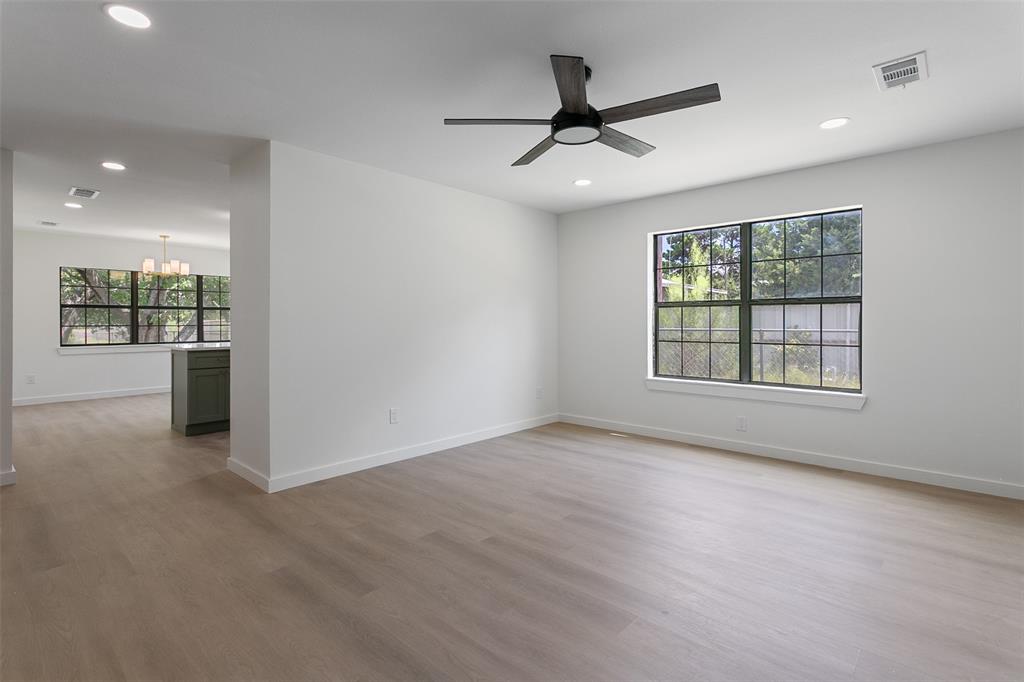 1346 South Reno Road Springtown, TX 76082 - Photo 6 of 24 Bright interior space featuring light wood-finish flooring, recessed lighting, and a modern ceiling fan