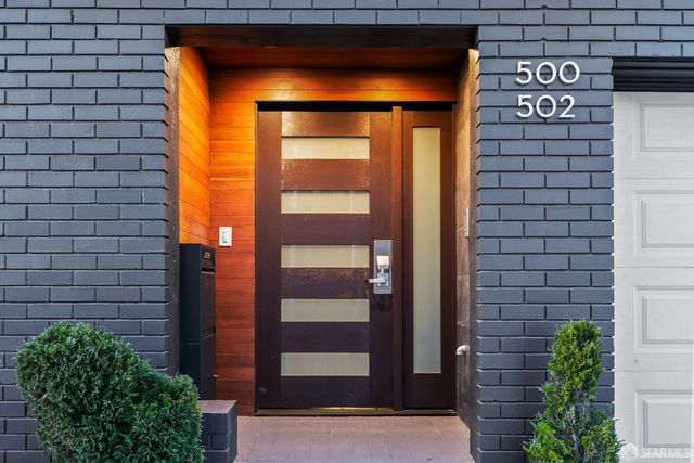 a front view of a house with a glass door
