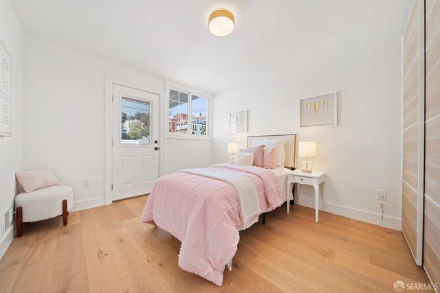 a bedroom with a bed and a couch