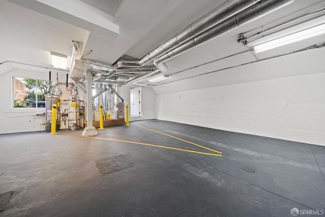 a view of empty room with wooden walls