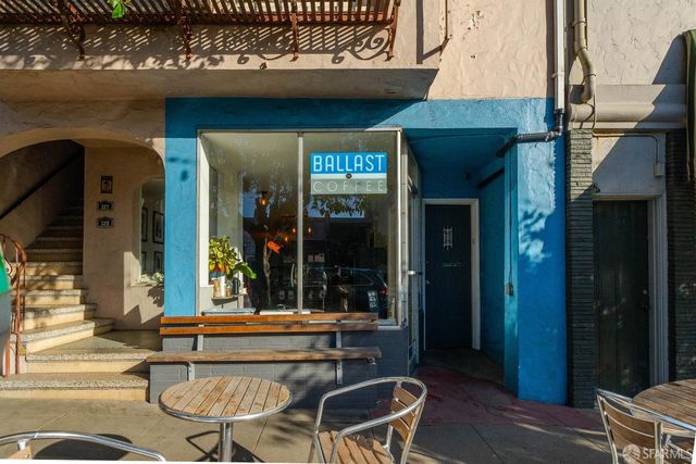 a view of a street with sitting area