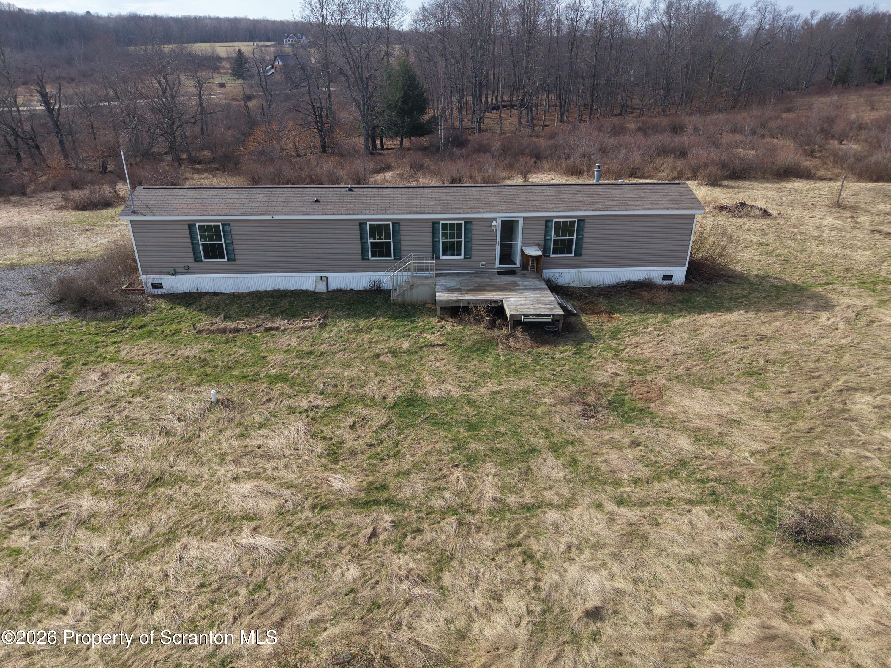 65 Ross Hill Road Thompson, PA 18465 - Photo 3 of 26 Elevated Front (1)