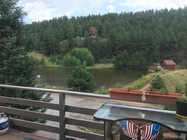 945 Wisp Creek Drive Bailey, CO 80421 - Photo 11 of 26 a view of a outdoor sitting area with lake view