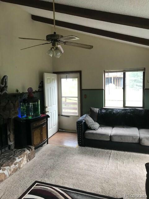 945 Wisp Creek Drive Bailey, CO 80421 - Photo 14 of 26 a living room with furniture and a window