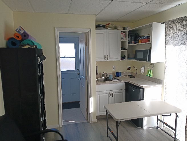 92-8968 Reef Parkway Ocean View, HI 96704 - Photo 4 of 10 a kitchen with a refrigerator and cabinets