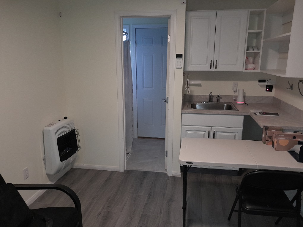 92-8968 Reef Parkway Ocean View, HI 96704 - Photo 5 of 10 a kitchen with a sink cabinets and wooden floor