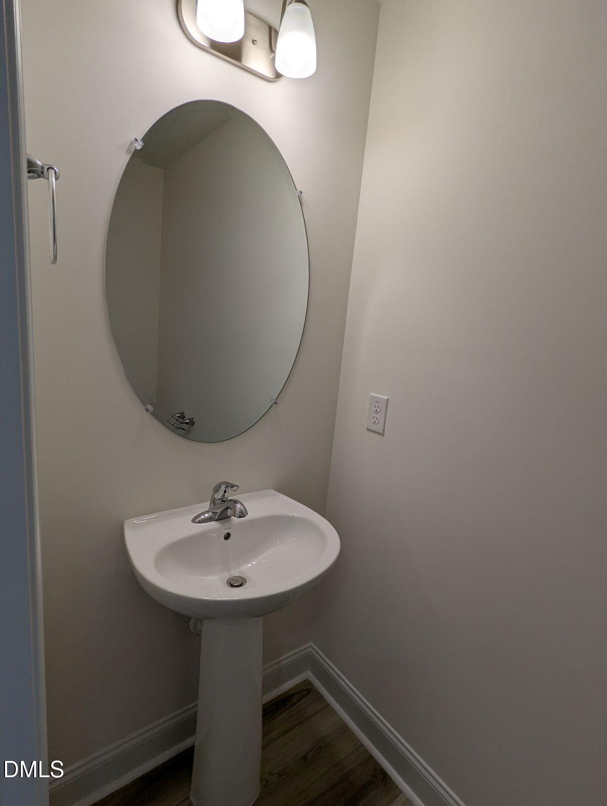908 Kensley Grv Lane Fuquay-Varina, NC 27526 - Photo 17 of 37 a bathroom with a sink and a mirror