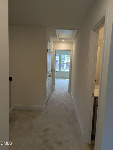 a view of a hallway with staircase