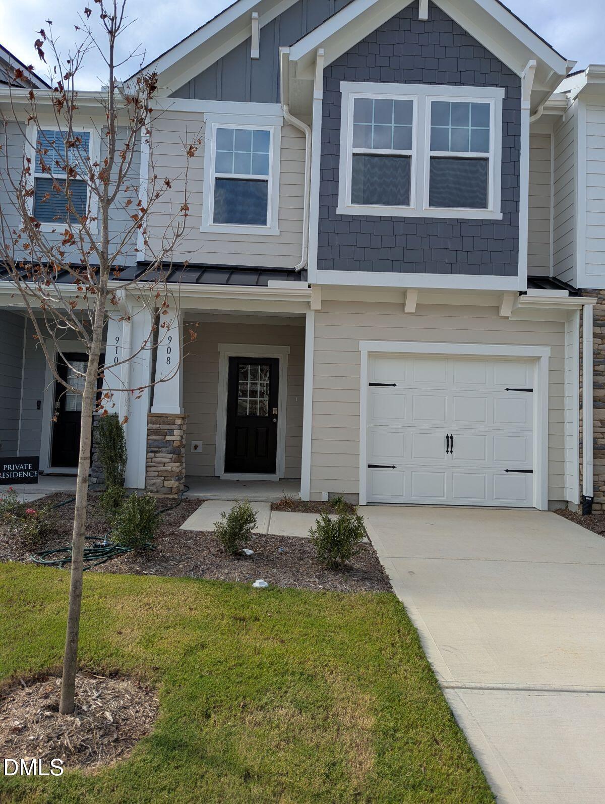 908 Kensley Grv Lane Fuquay-Varina, NC 27526 - Photo 2 of 37 a front view of a house with garden