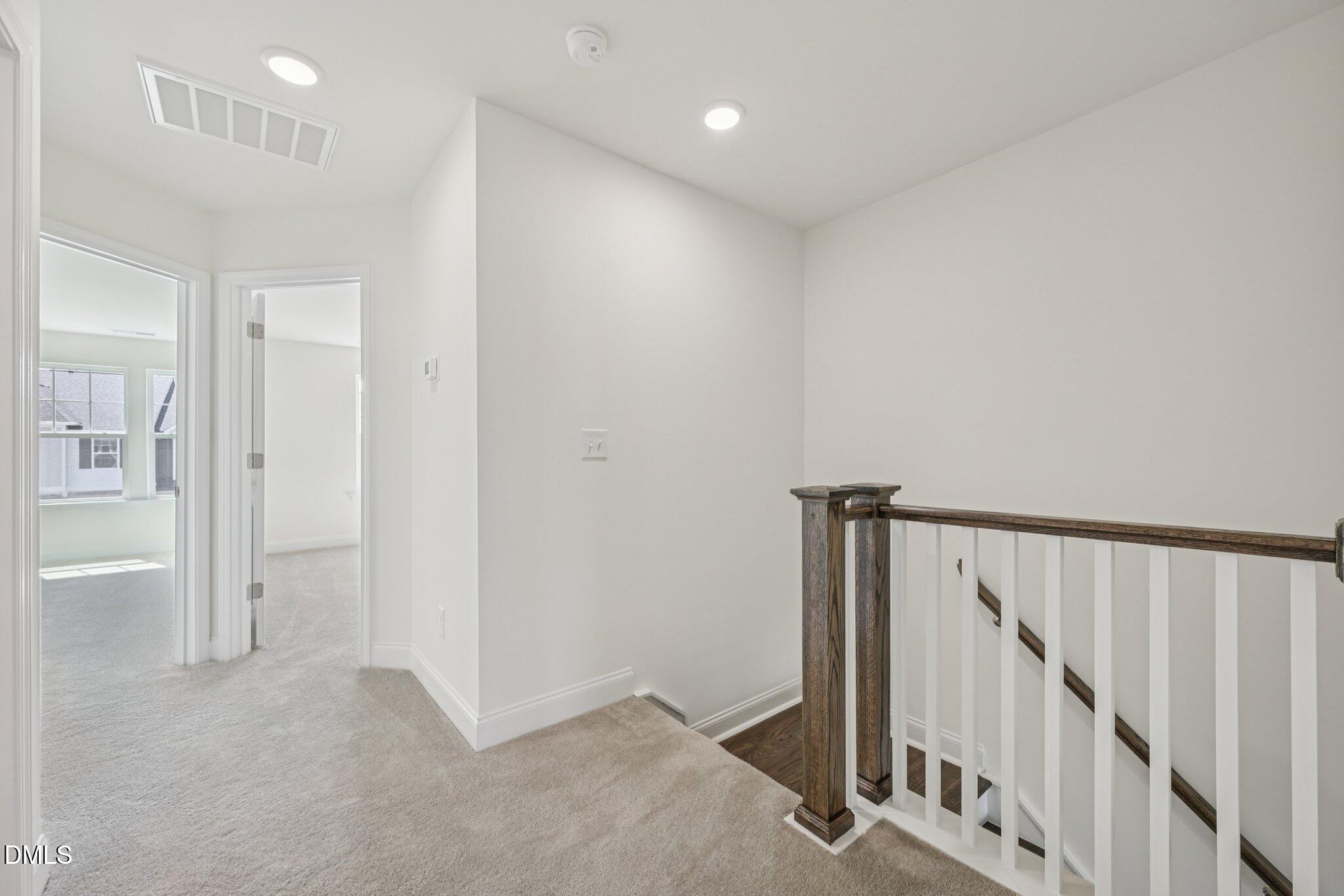 908 Kensley Grv Lane Fuquay-Varina, NC 27526 - Photo 21 of 37 a view of a hallway with staircase