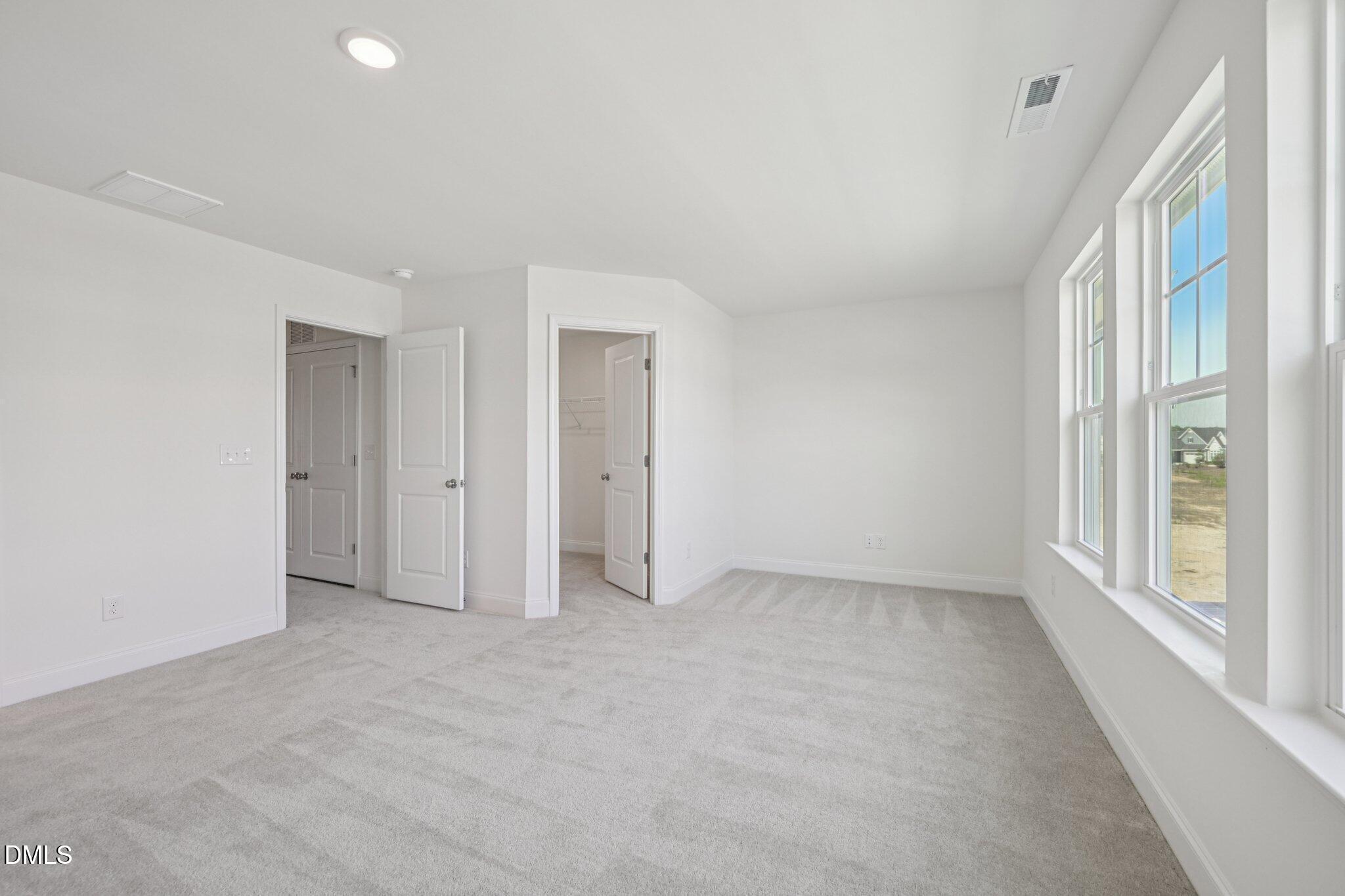 908 Kensley Grv Lane Fuquay-Varina, NC 27526 - Photo 22 of 37 a view of an empty room with a window