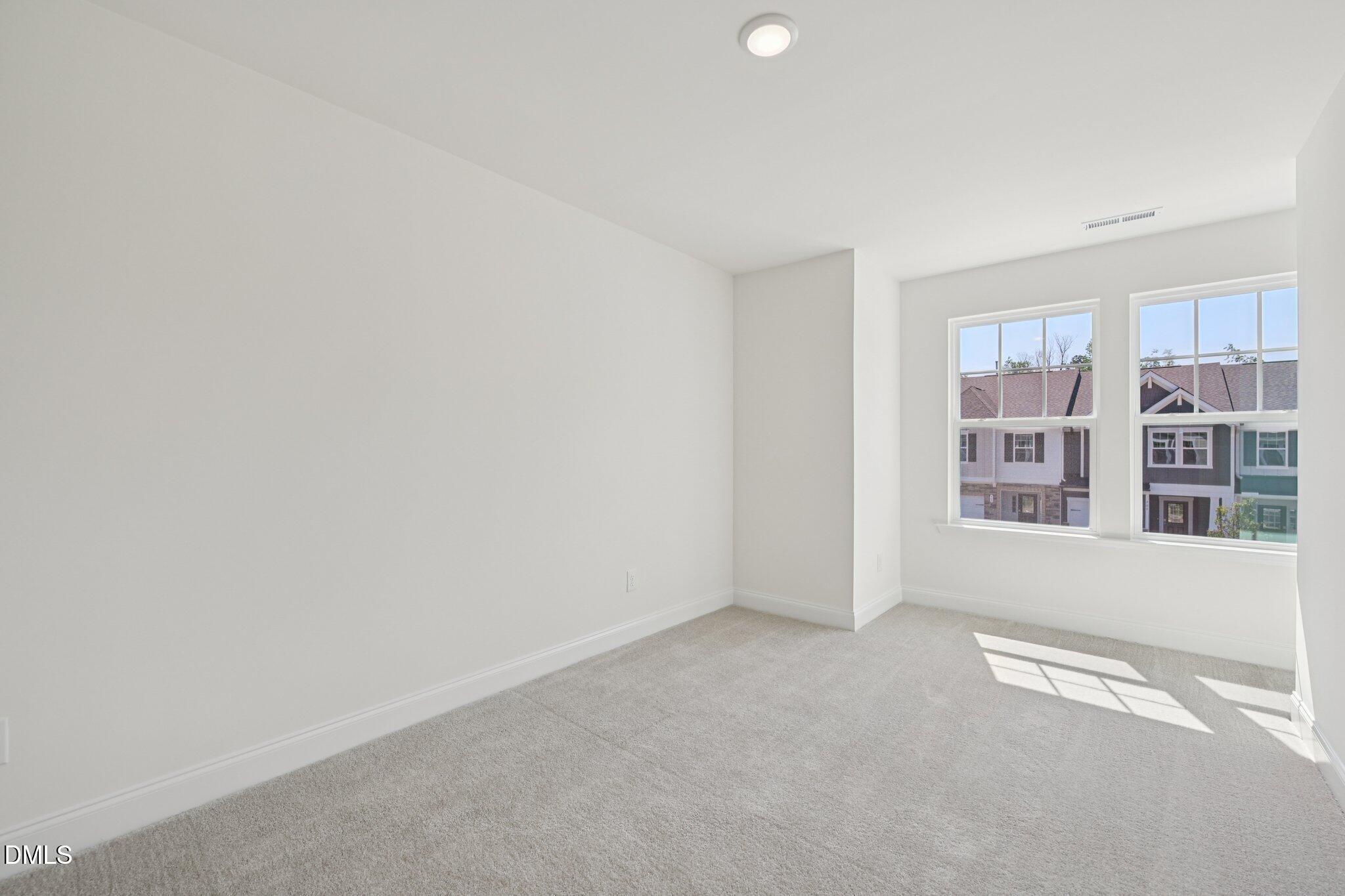 908 Kensley Grv Lane Fuquay-Varina, NC 27526 - Photo 26 of 37 a view of an empty room with a window