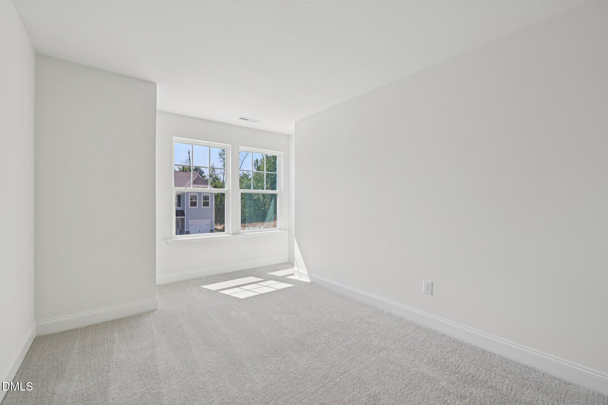 908 Kensley Grv Lane Fuquay-Varina, NC 27526 - Photo 27 of 37 a view of an empty room with a window