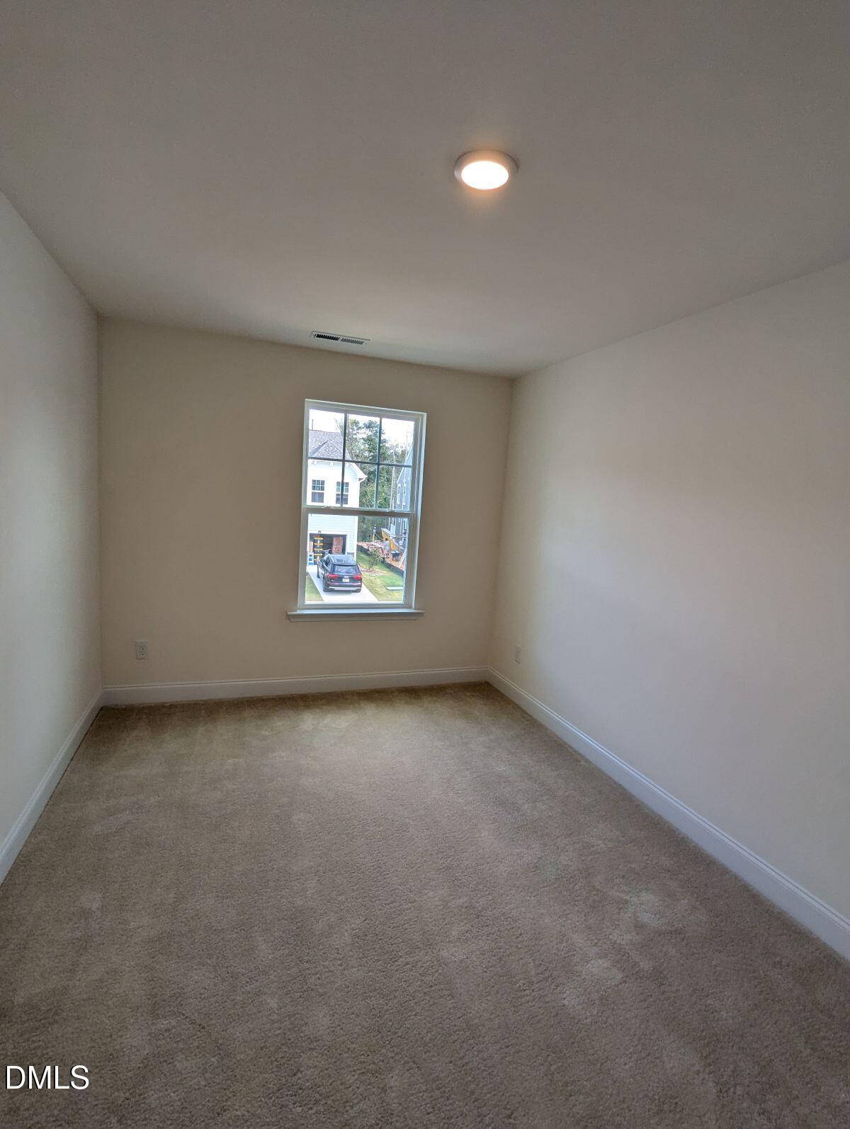 908 Kensley Grv Lane Fuquay-Varina, NC 27526 - Photo 29 of 37 an empty room with windows