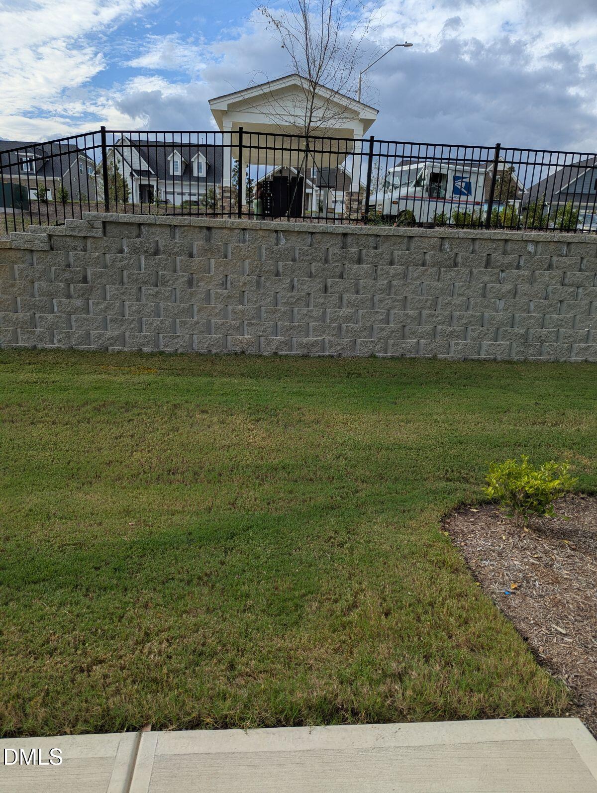908 Kensley Grv Lane Fuquay-Varina, NC 27526 - Photo 32 of 37 a view of a swimming pool with a yard