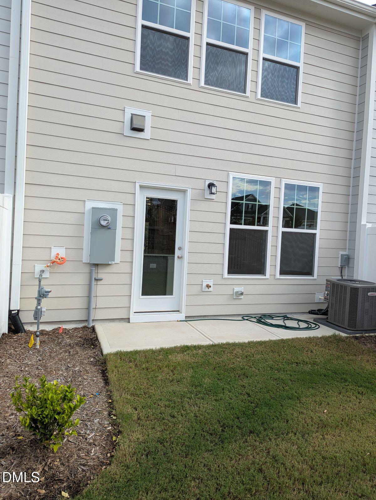 908 Kensley Grv Lane Fuquay-Varina, NC 27526 - Photo 33 of 37 a front view of a house with a yard