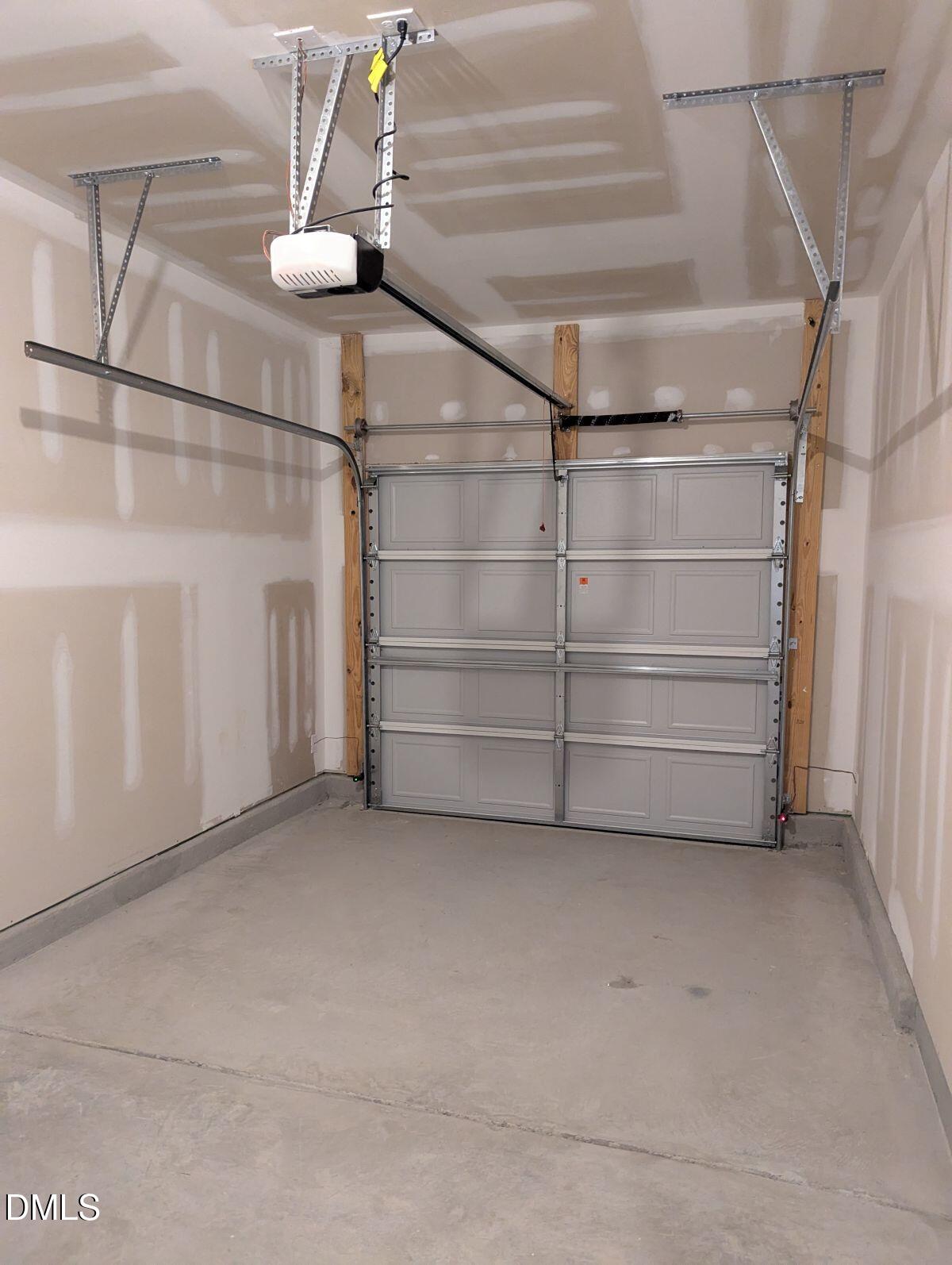 908 Kensley Grv Lane Fuquay-Varina, NC 27526 - Photo 35 of 37 a view of a store room with racks on the wall