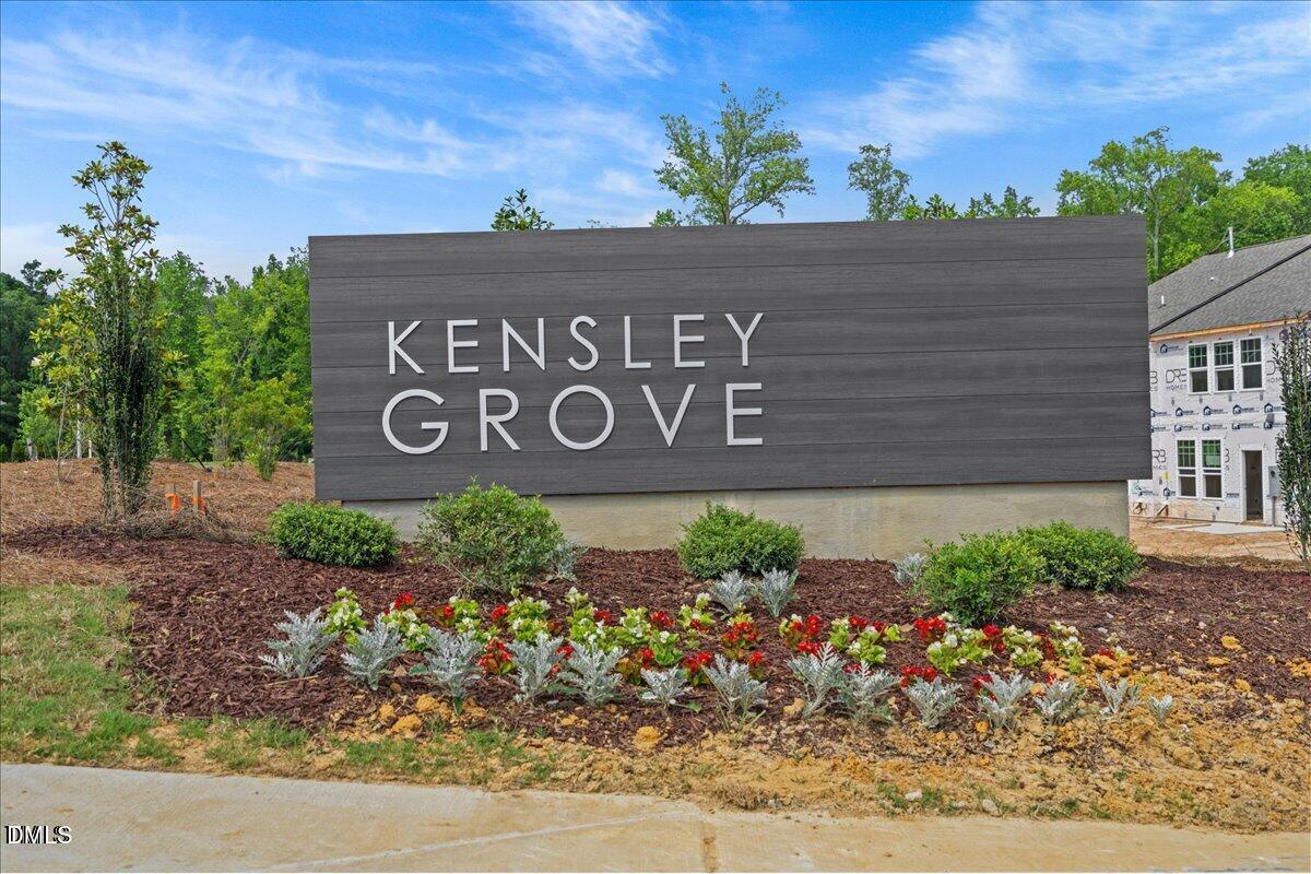 908 Kensley Grv Lane Fuquay-Varina, NC 27526 - Photo 36 of 37 a sign that is on the side of the road