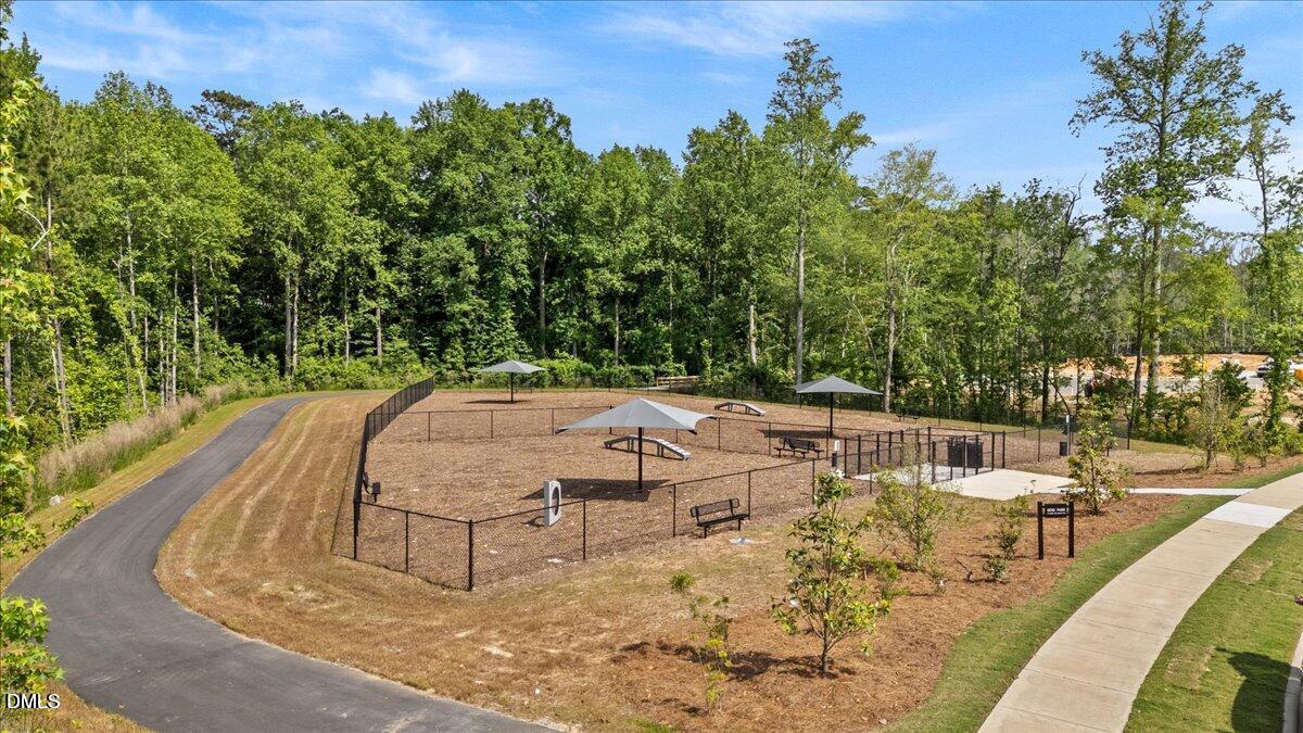 908 Kensley Grv Lane Fuquay-Varina, NC 27526 - Photo 37 of 37 a view of a swimming pool with a patio
