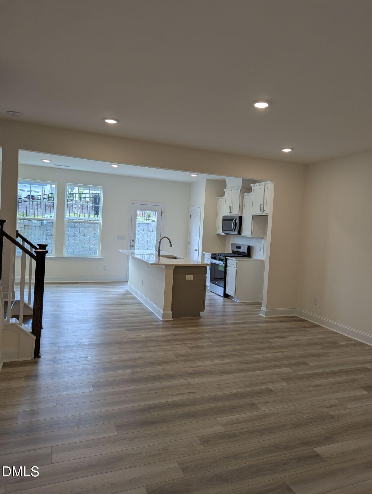 908 Kensley Grv Lane Fuquay-Varina, NC 27526 - Photo 6 of 37 a view of kitchen with cabinets and wooden floor
