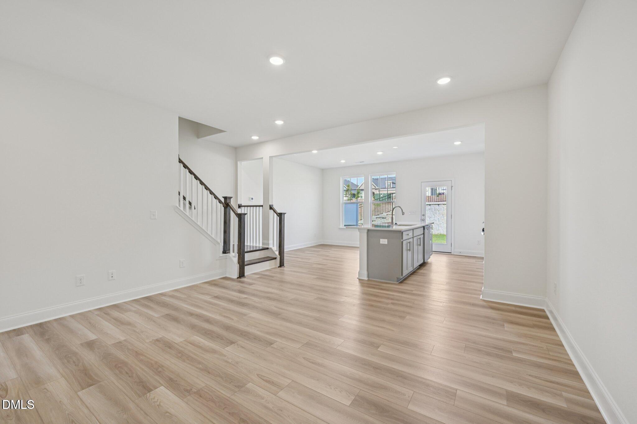 908 Kensley Grv Lane Fuquay-Varina, NC 27526 - Photo 7 of 37 a view of a kitchen with wooden floor