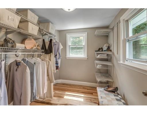 55 Cottage Road Boston, MA 02132 - Photo 14 of 30 a view of walk in closet with clothes and shoes